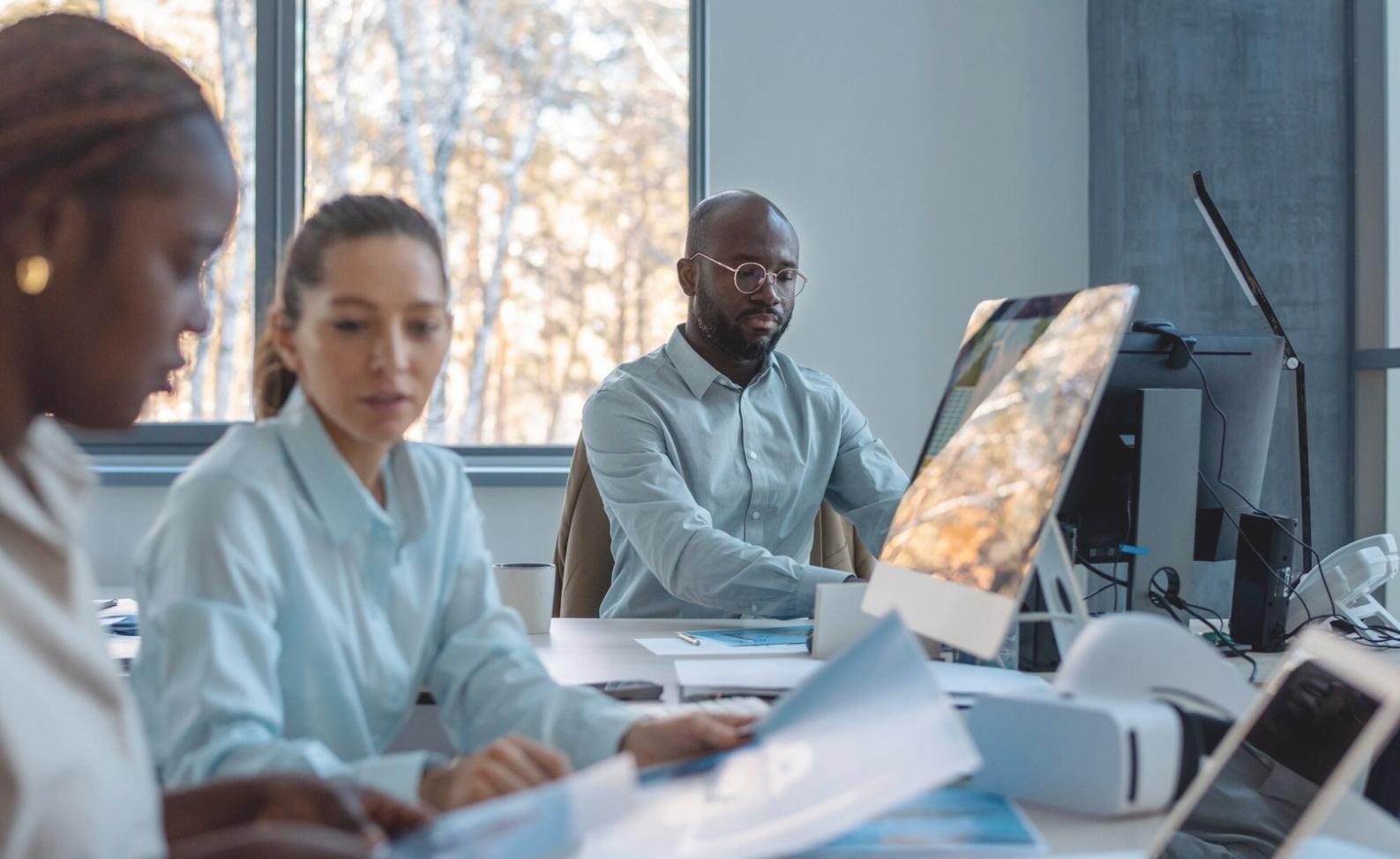 Person reviewing monthly budget spreadsheet with coffee